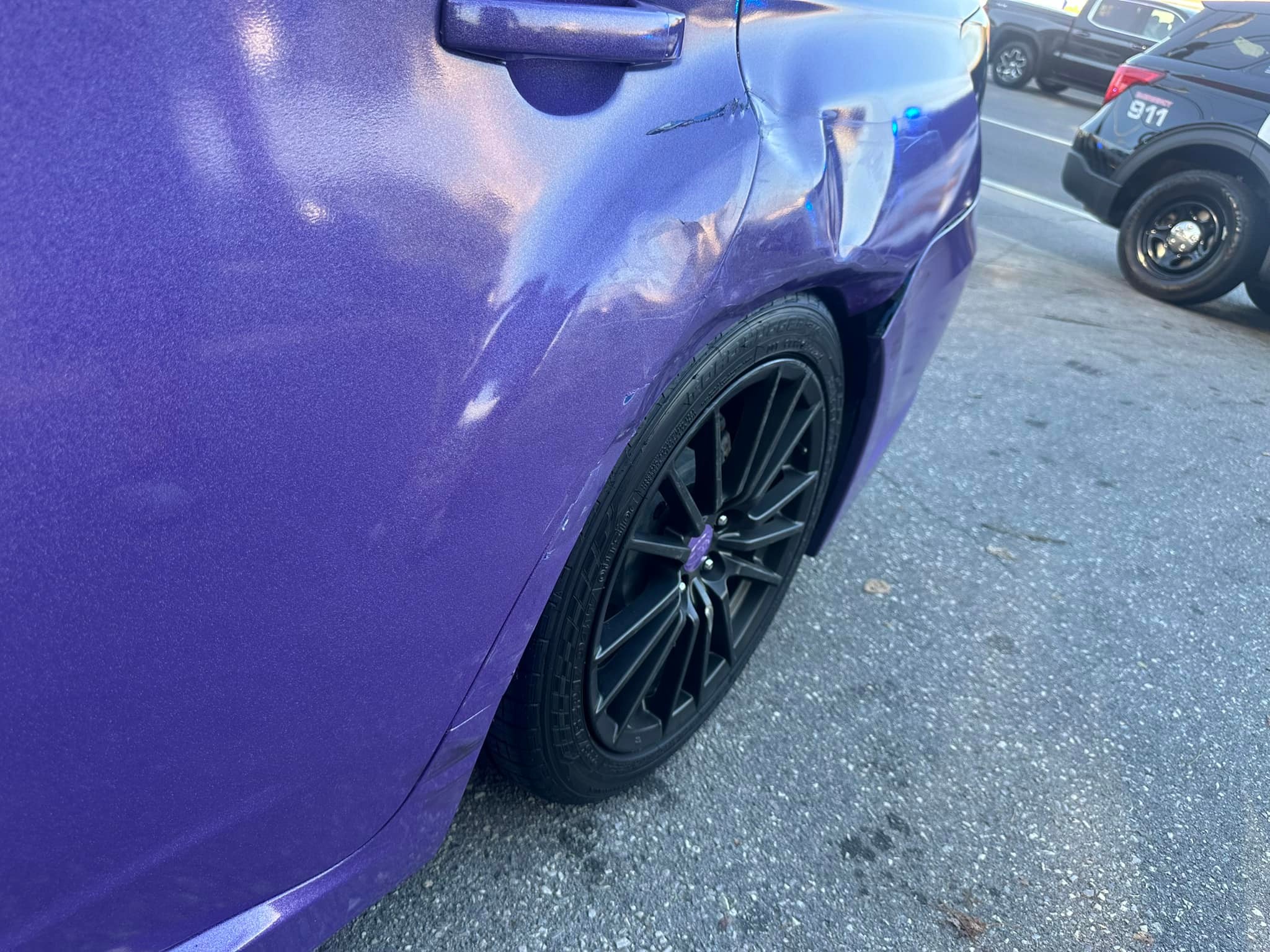 Should a 2013 WRX's damaged door and quarter panel be replaced or