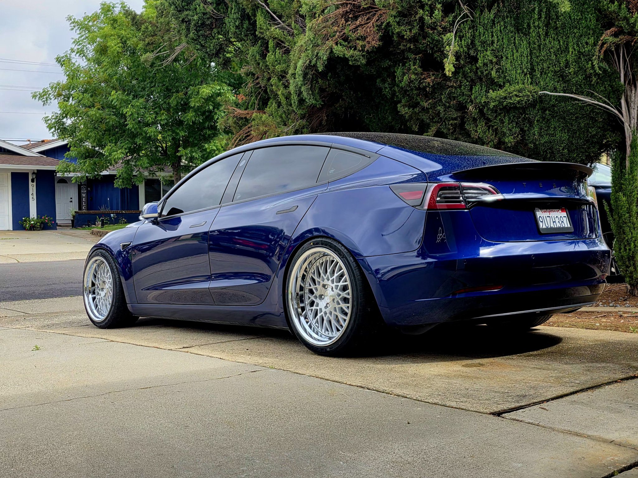 Tesla Model 3 with 18x11.5 drift spares on Toyota Cressida and