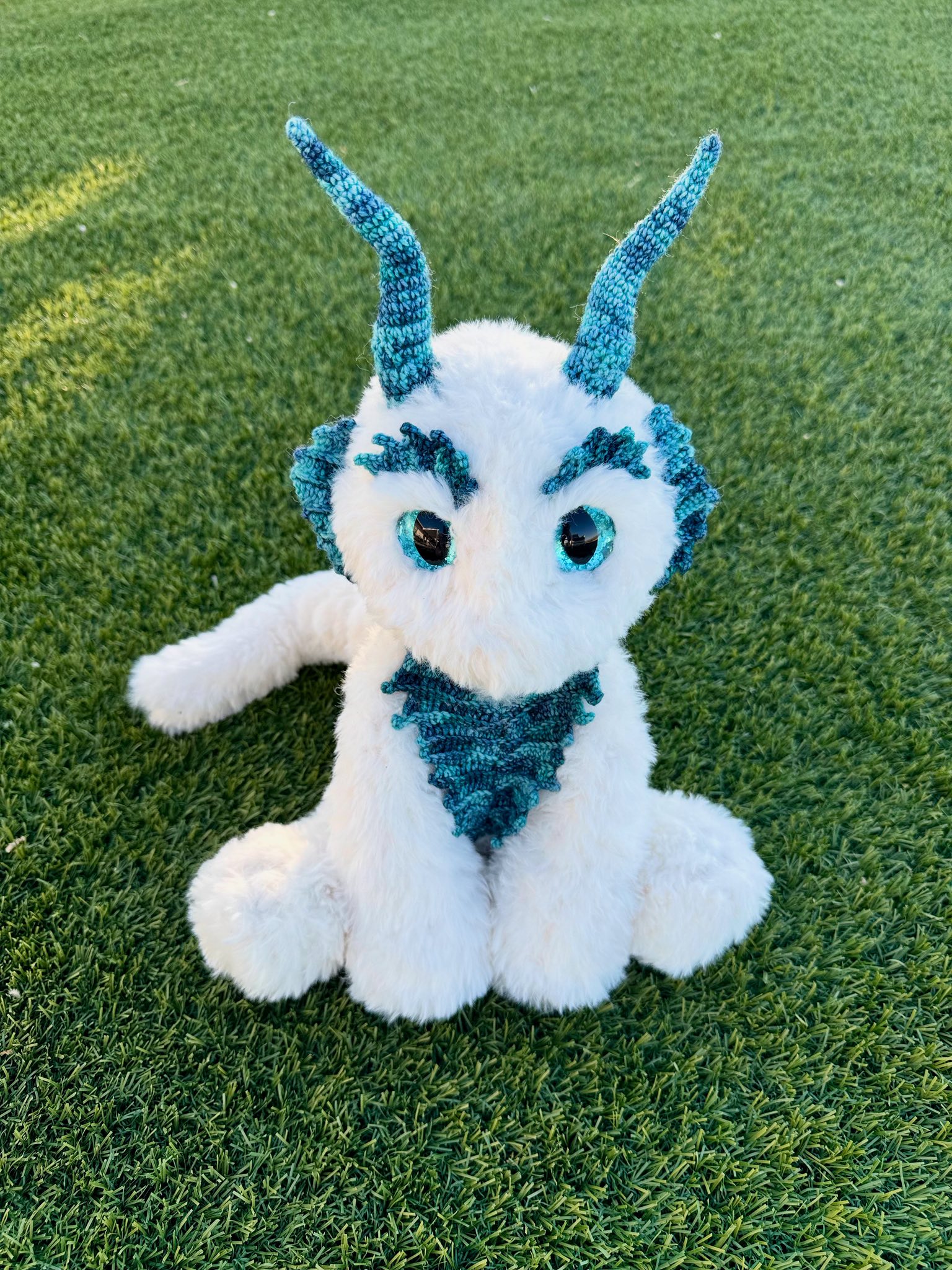 Crocheted fluffy dragon with faux fur and sock yarn