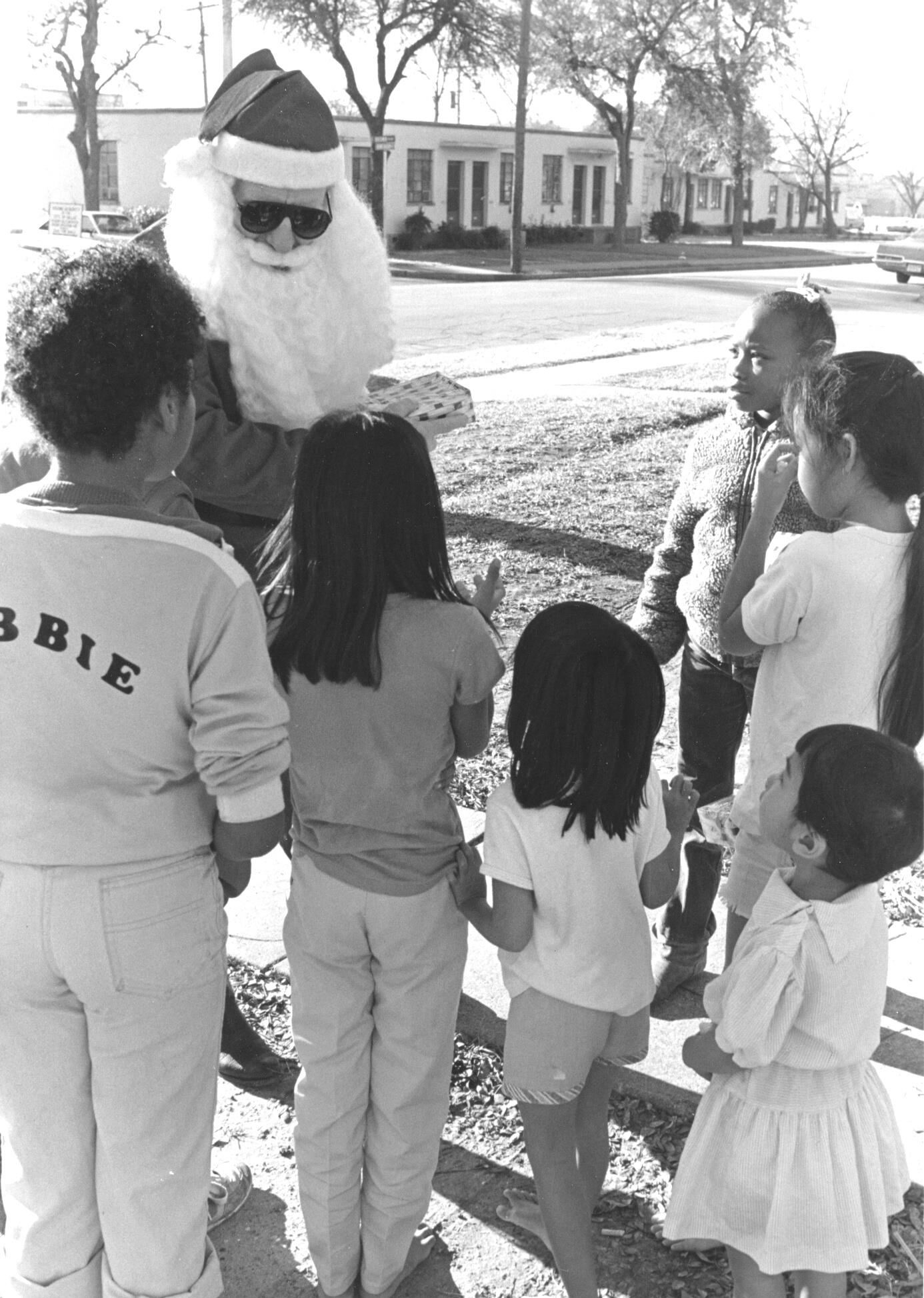 Dallas - Santa Claus visits residents of the Little Mexico Village ...
