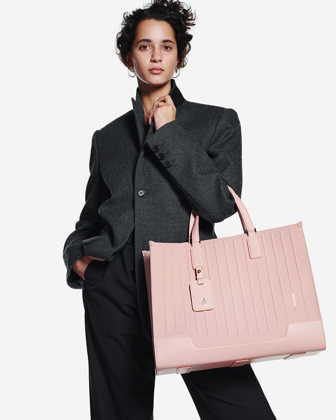 RIMOWA - The RIMOWA Never Still Tote in Desert Rose, captured by