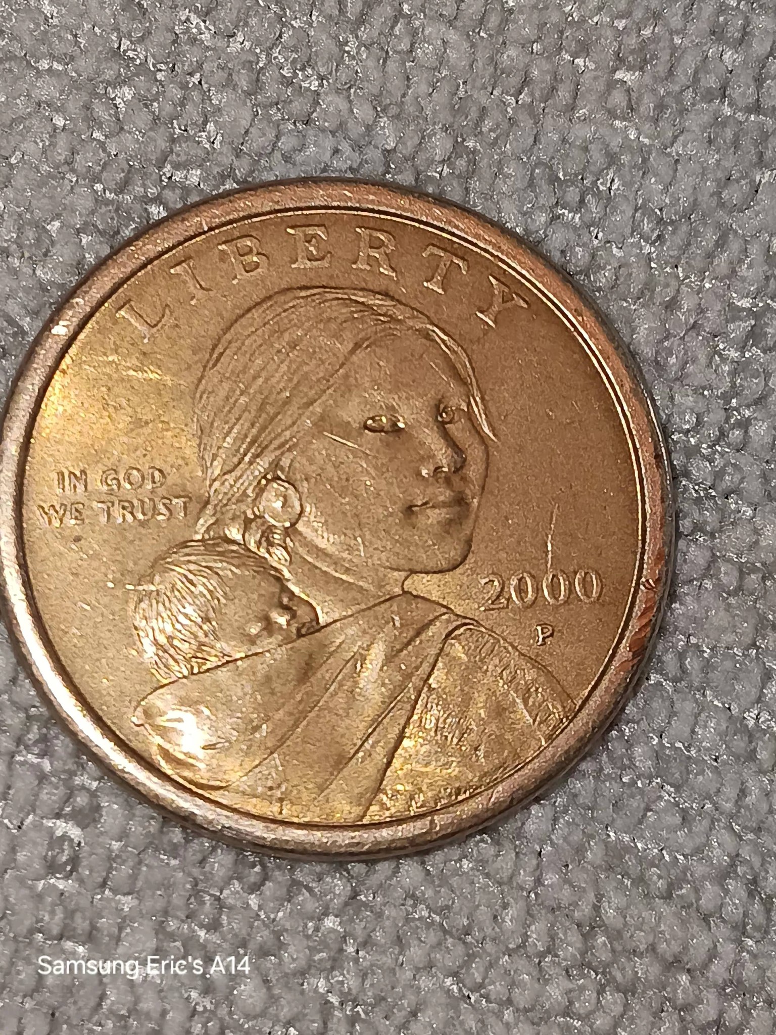 I believe this is a Worn down Cheerio Dollar Sacagawea 2000 P