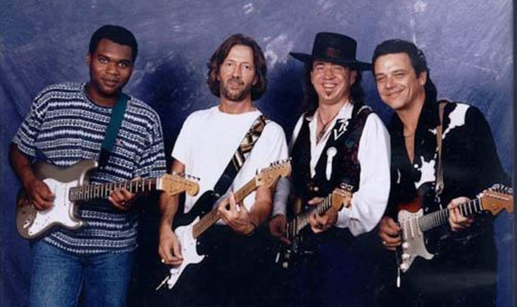 1990 photograph of Eric Clapton, Stevie Ray Vaughan and Robert