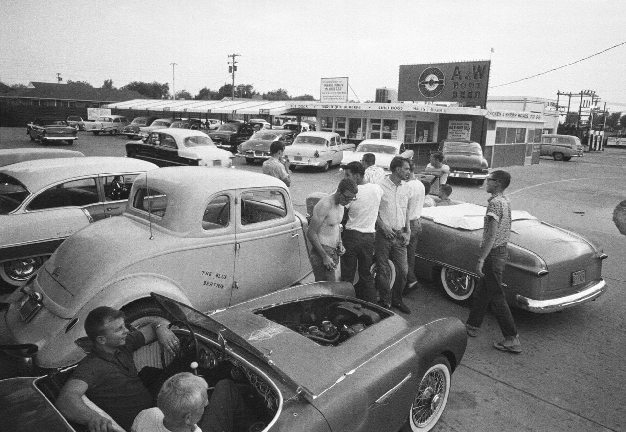 Teenagers in the parking lot of an A&W drive-in in Hutchinson