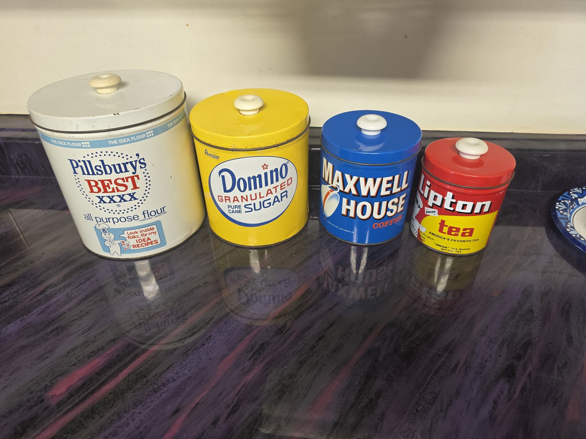 Vintage food cans from estate sale, including Pillsbury flour