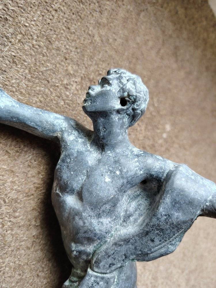 What is this ancient bronze sculpture of a man throwing a javelin?