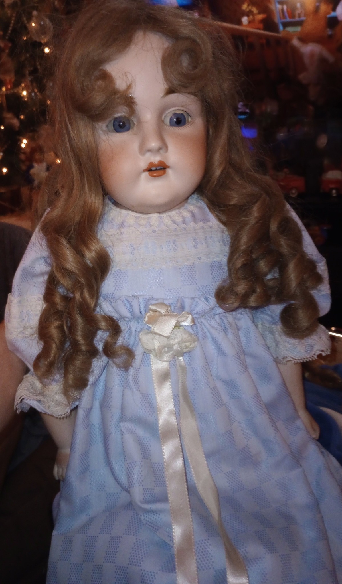 What is this vintage porcelain head doll with leather body?