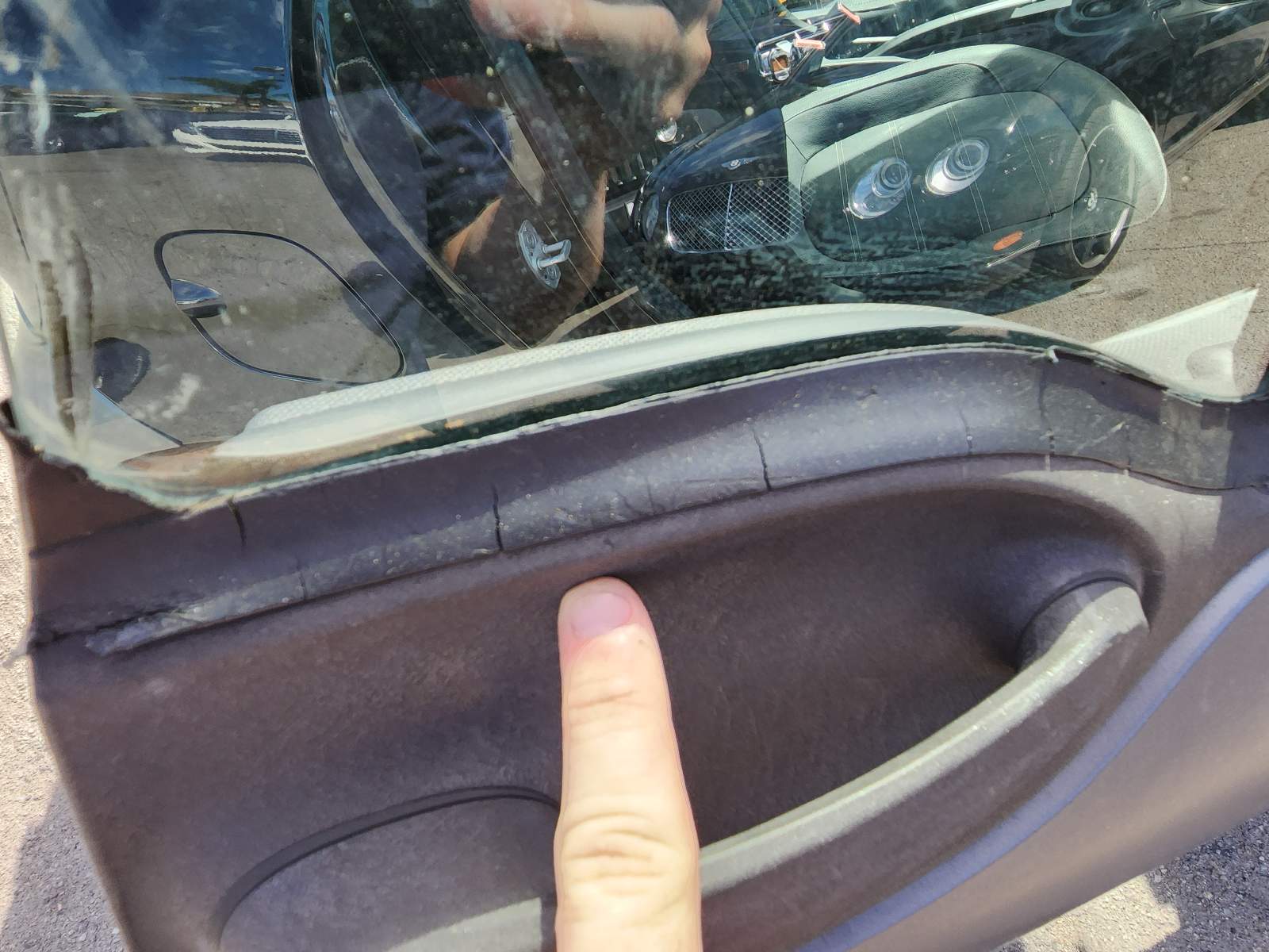 What is the part number for the trim above the right door handle 