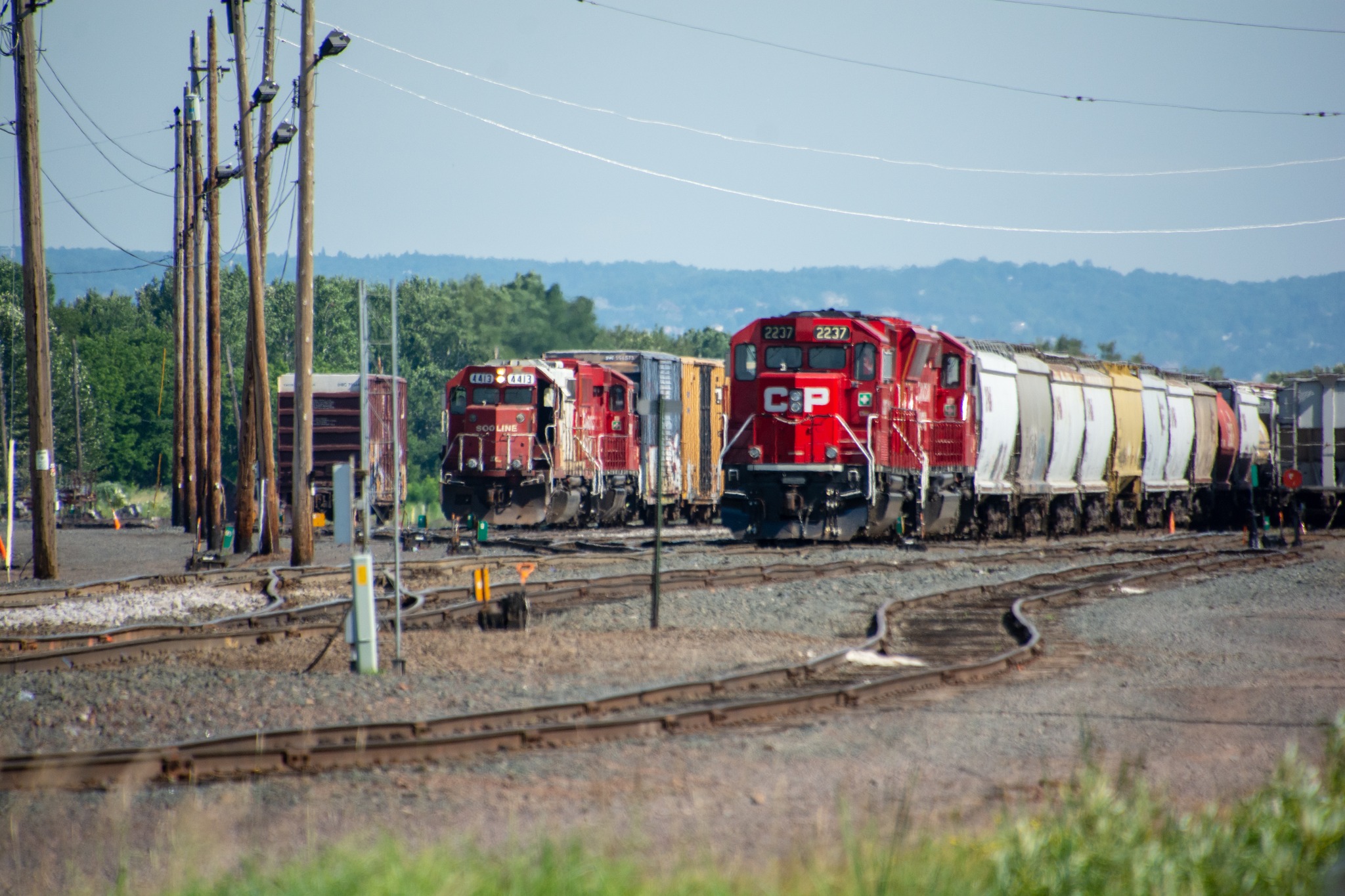 Canadian Pacific train led by a red barn in Duplainville, WI