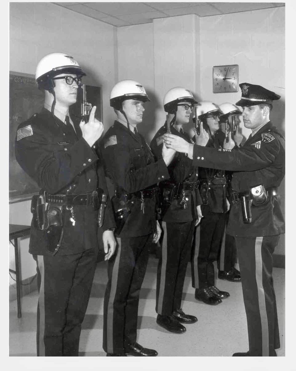 1960s Lincoln Police, Nebraska. The caption reads, Officers