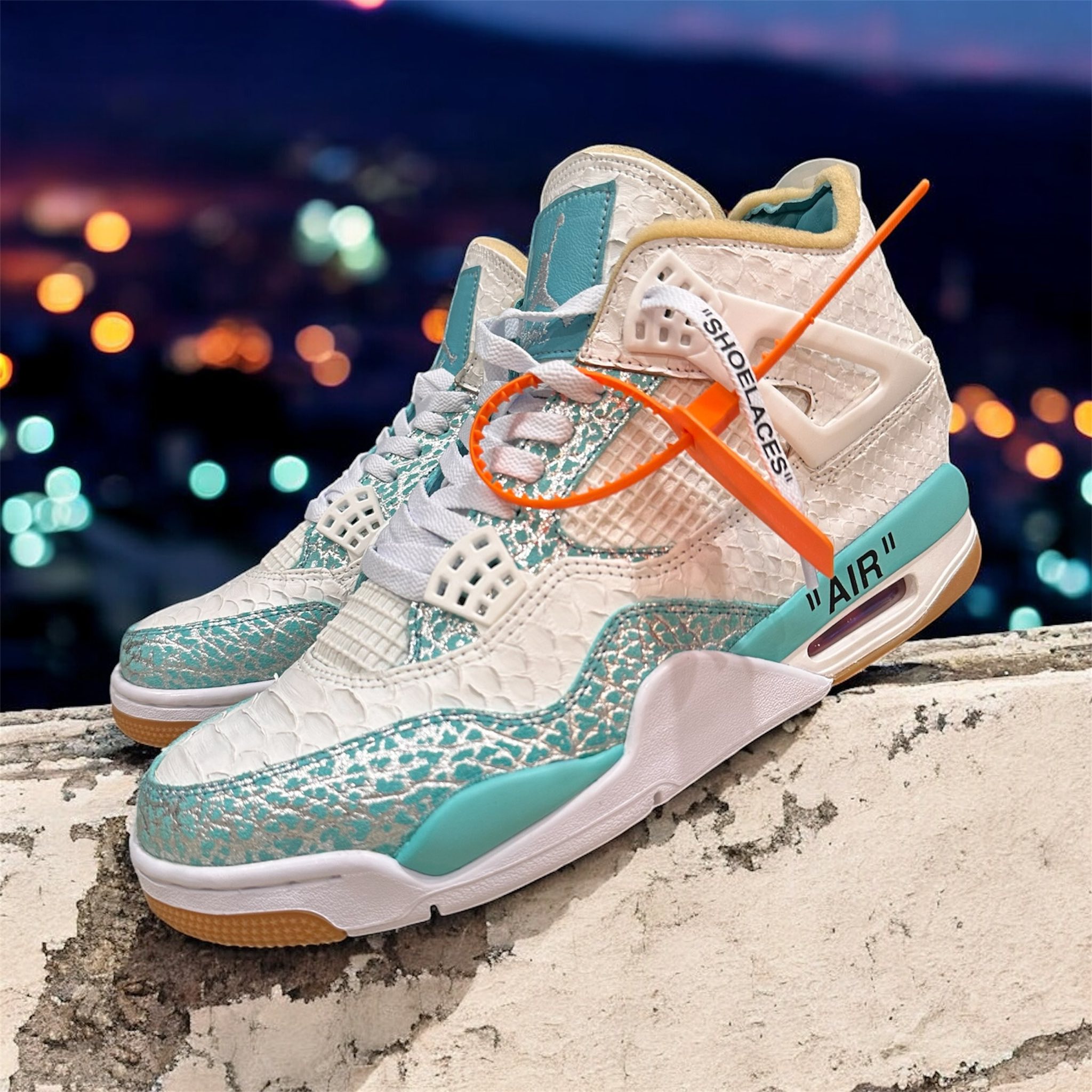 Custom Jordan 4 Luxe Off-White sneakers with Tiffany blue elephant 