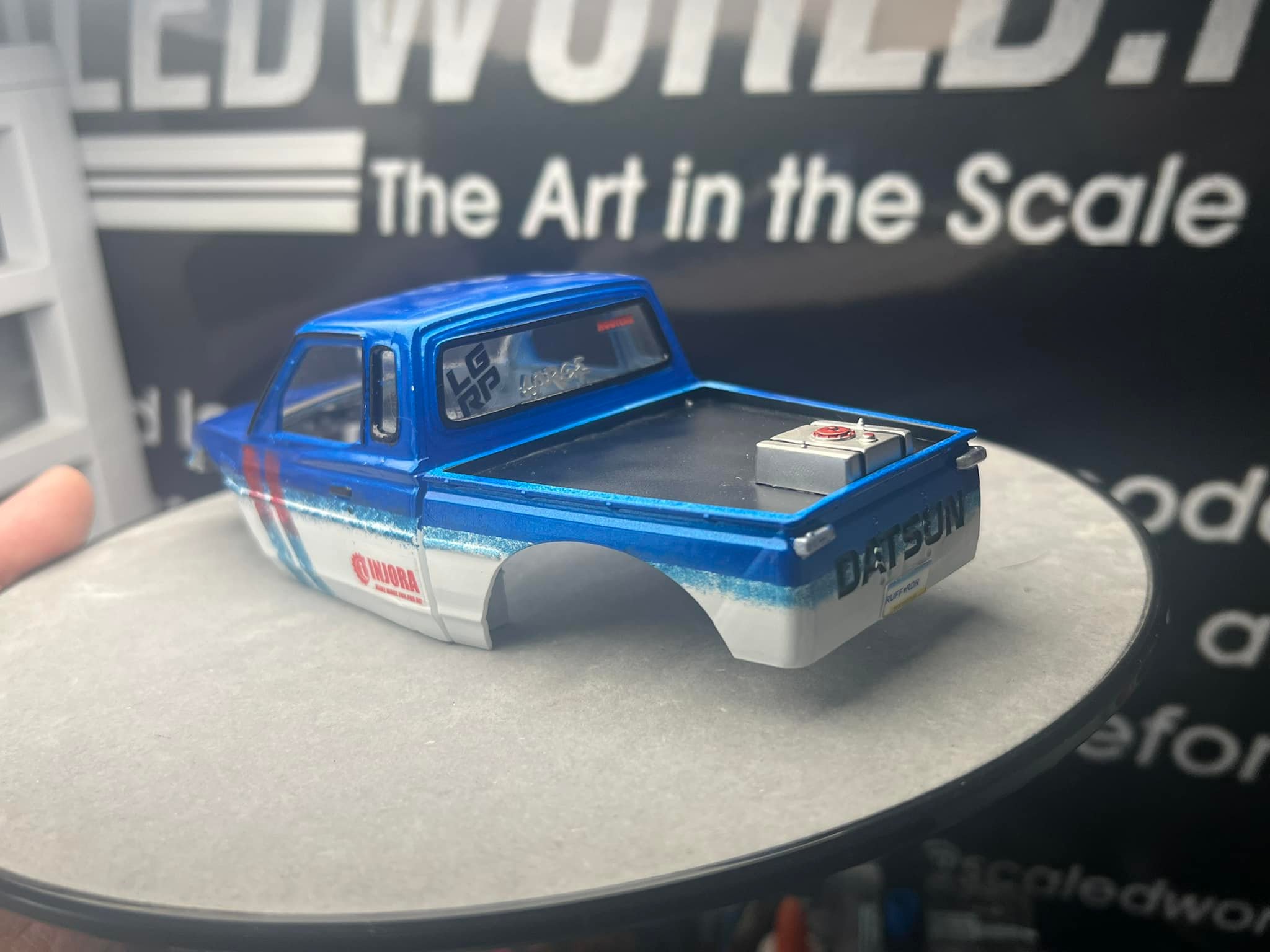 Datsun, Toyota, and Nissan RC cars, including a Calsonic Blue Nissan