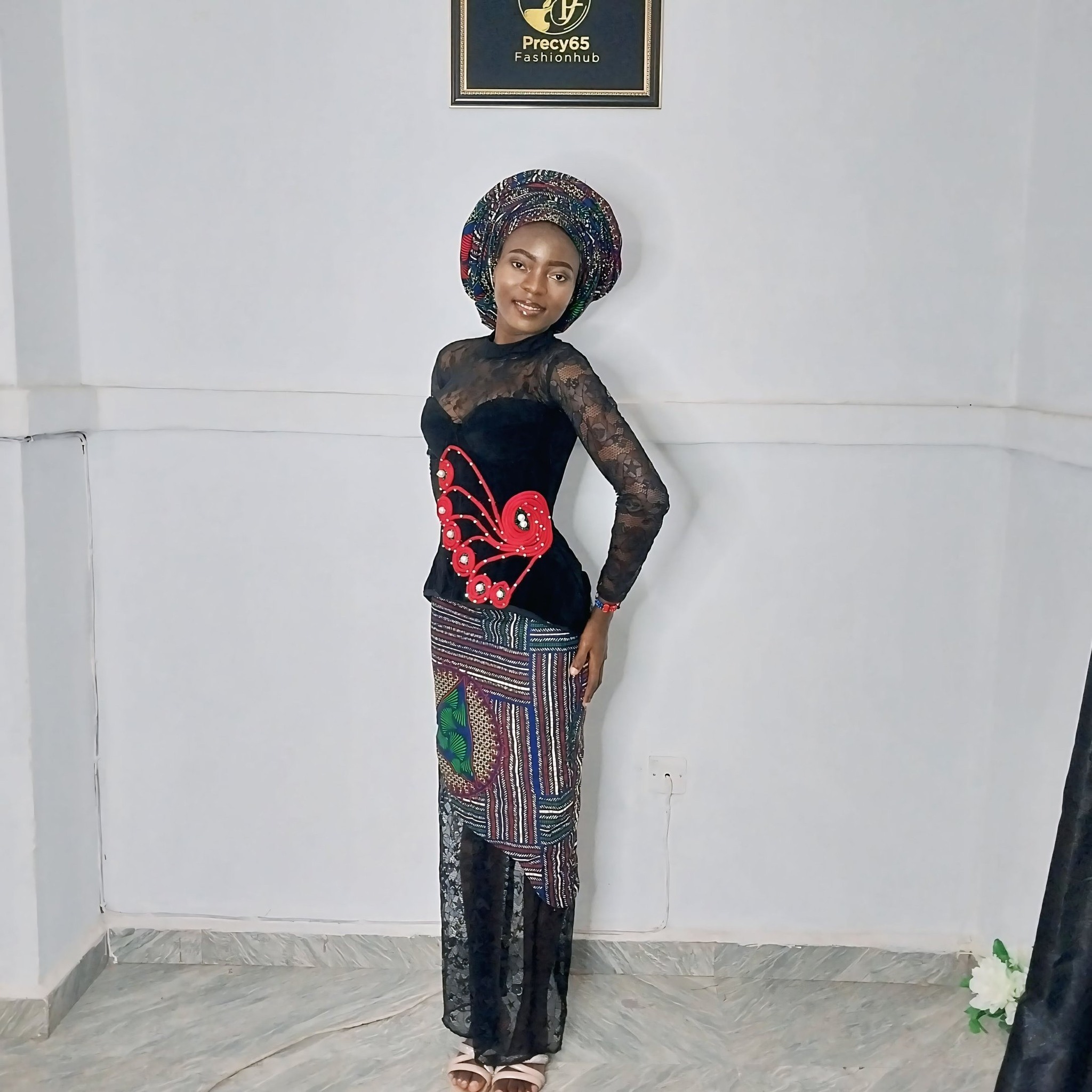 This striking ensemble worn by Nana Aba features a structured 