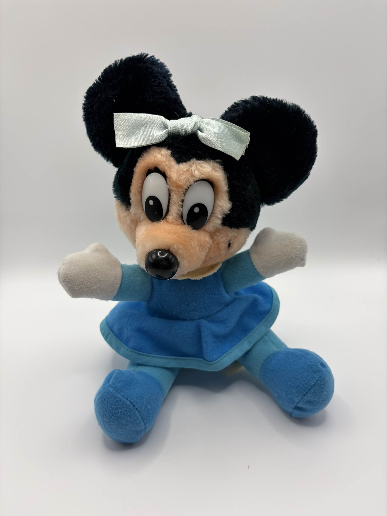 Vintage Walt Disney Productions Minnie Mouse plush featured in her blue dress outfit as Mrs. Cratchit from Mickey's Christmas Carol. Features original tush tag labeled 
