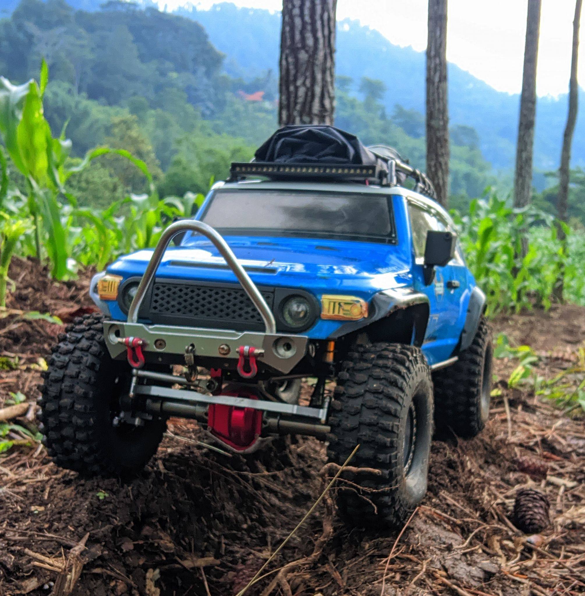 A daring move: a Land Cruiser plunges into the mud, its engine nearly ...