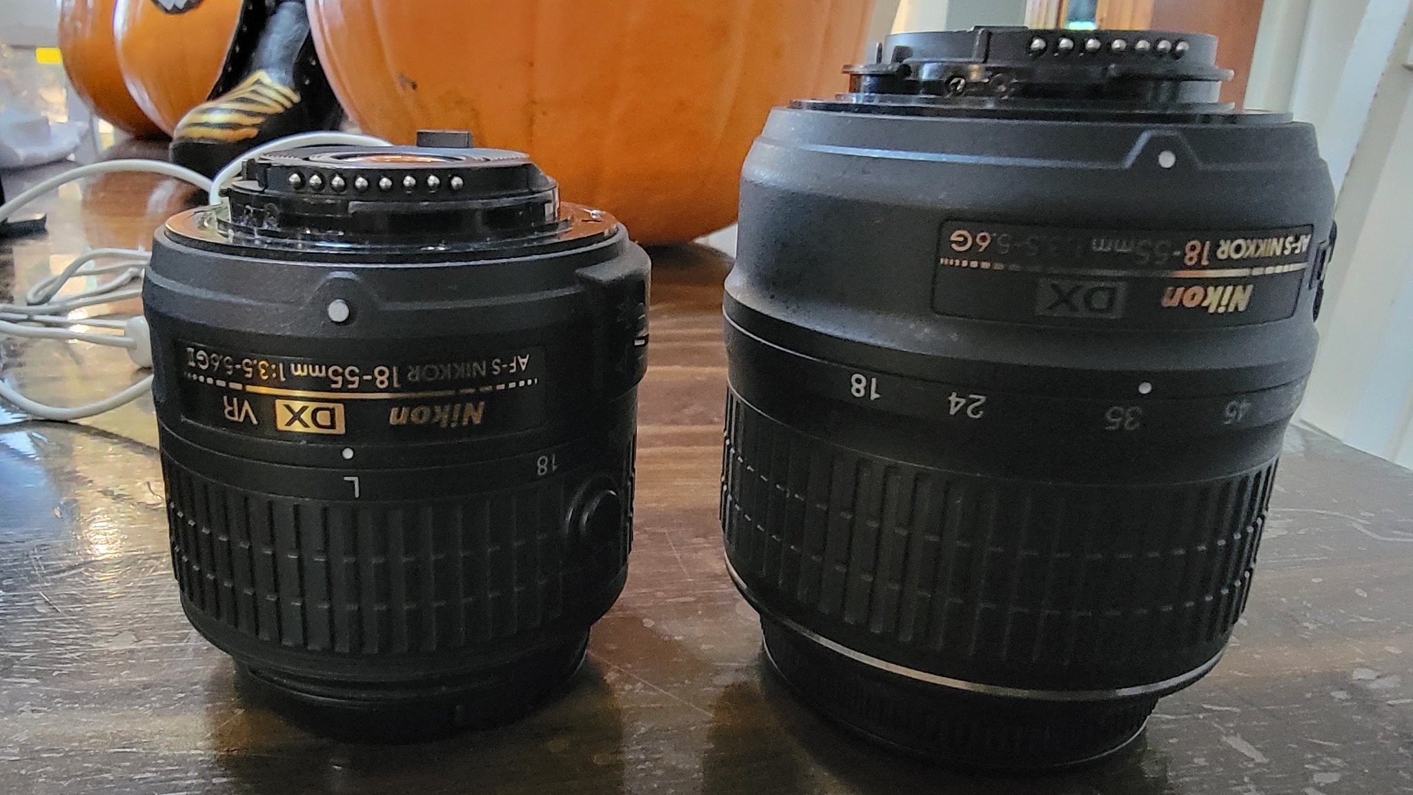 Which lens is preferred, AF-S NIKKOR 18-55mm f/3.5-5.6G.VR or AF-S 