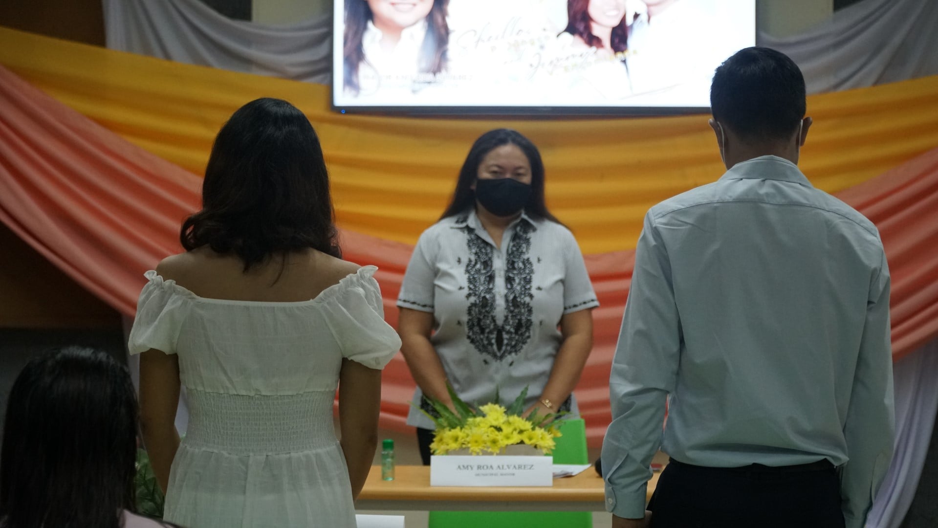 Mayor Amy Roa Alvarez officiates the wedding of two couples in a simple ...