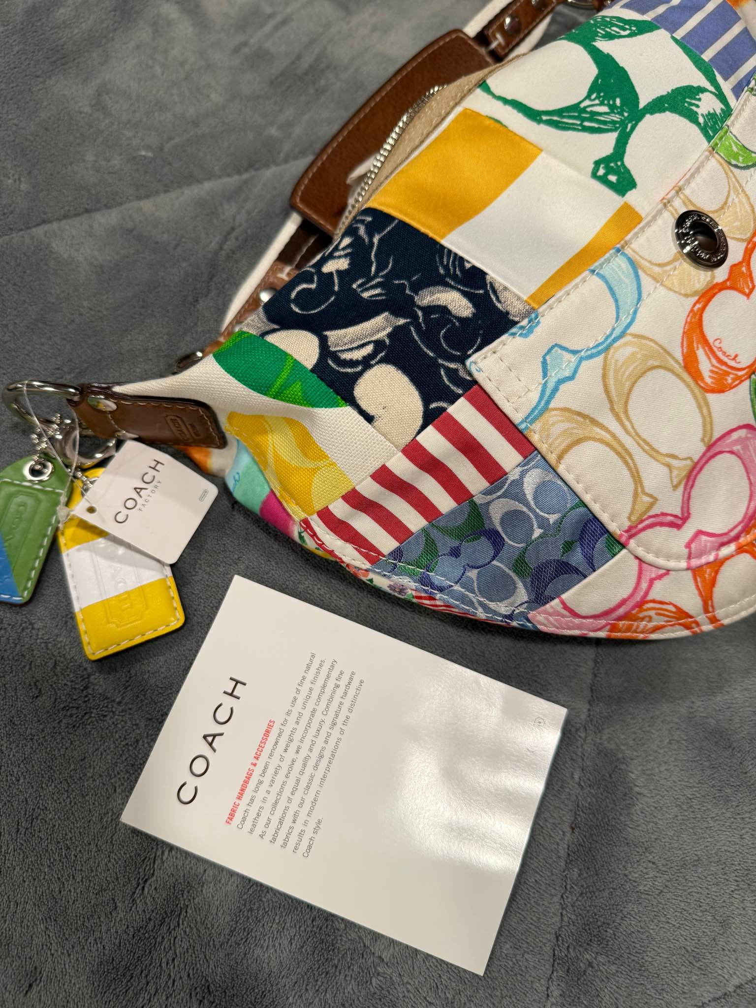 How much can I ask for a new Coach Patchwork Scribble Hobo bag?