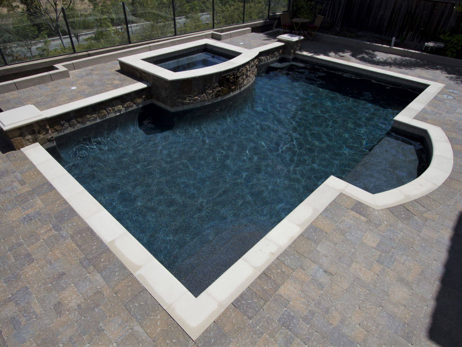 Dark finishes like this custom... - NPT - National Pool Tile