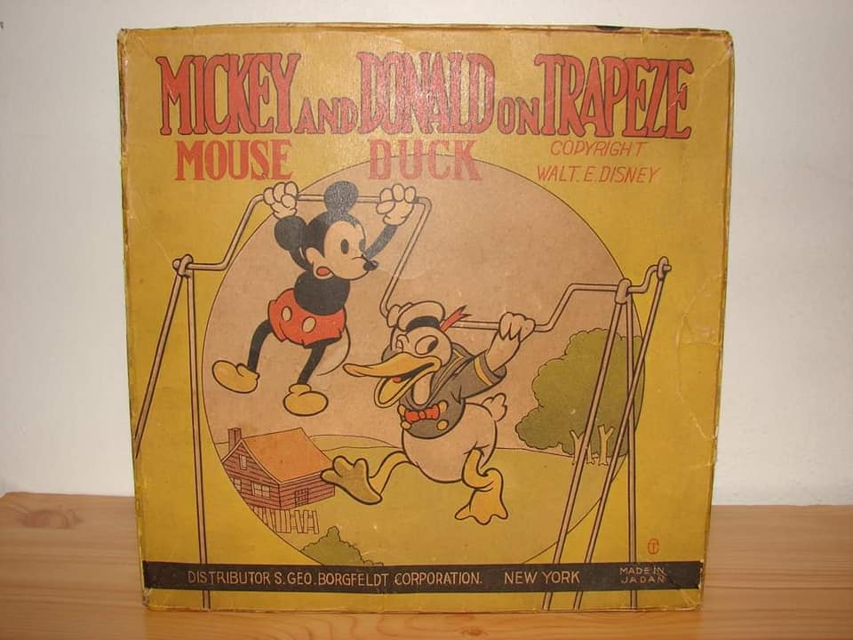 Mickey and Donald Duck on Trapeze celluloid and tin wind up toy