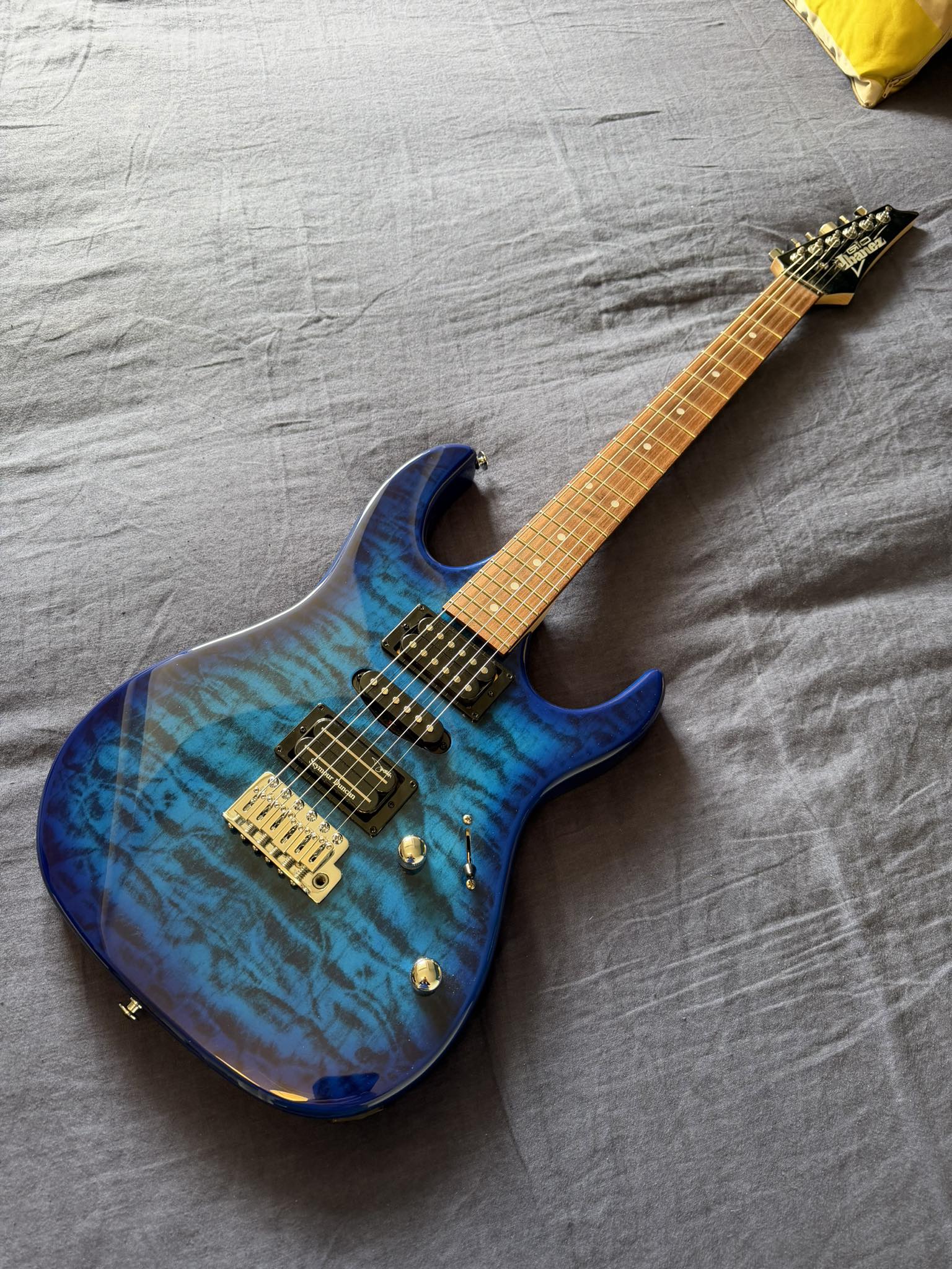 Upgraded Ibanez Gio GRX70QA-TBB guitar