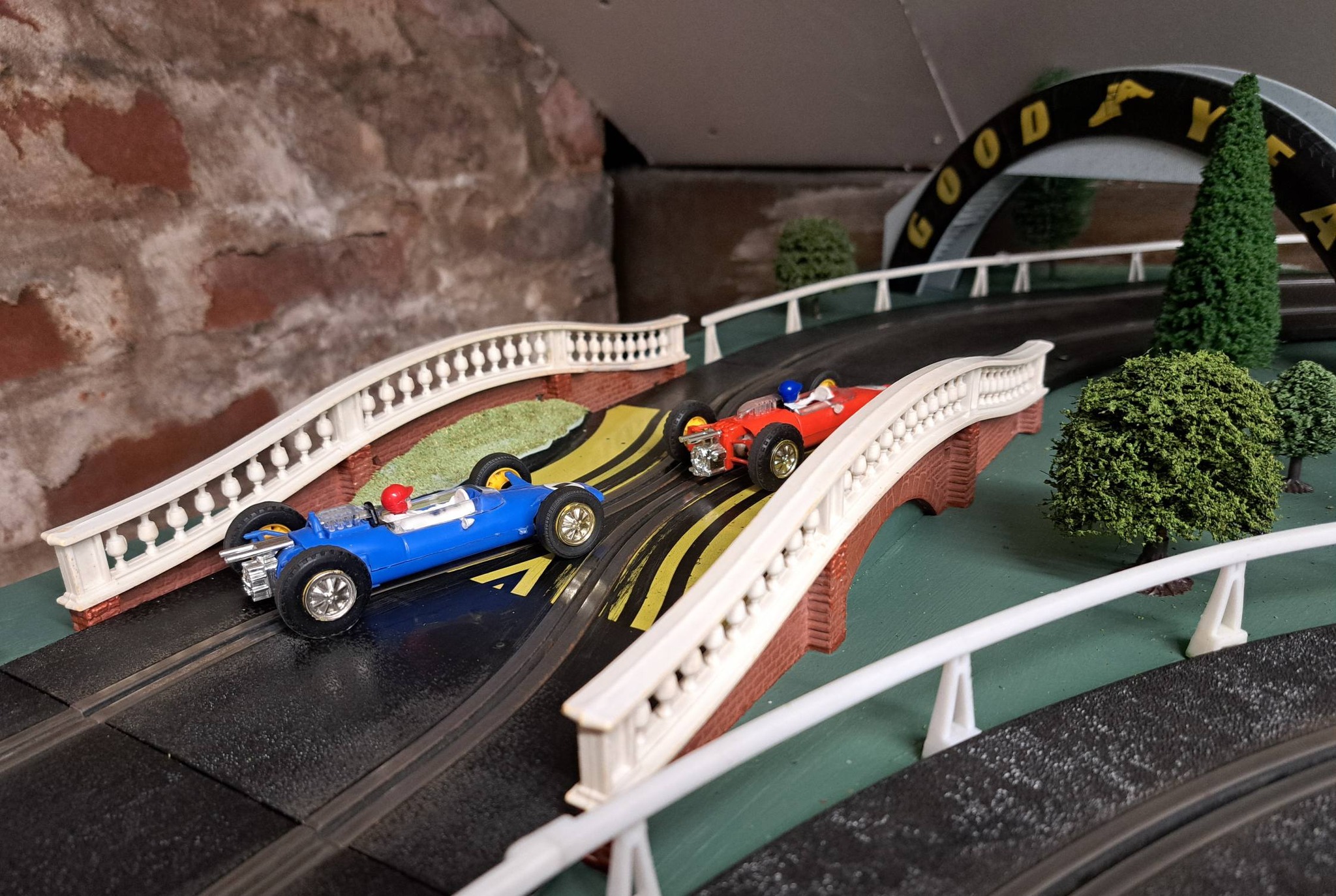 Vintage Scalextric track with hump back bridge decoration