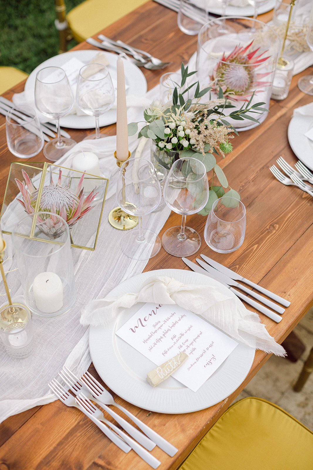 Style A Wedding - A delicate table setting enhanced by...