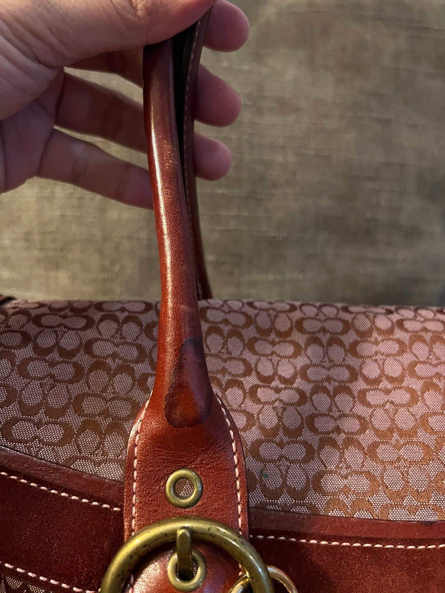 This handbag is a Francesco Biasia Secret Love Bag, a designer 