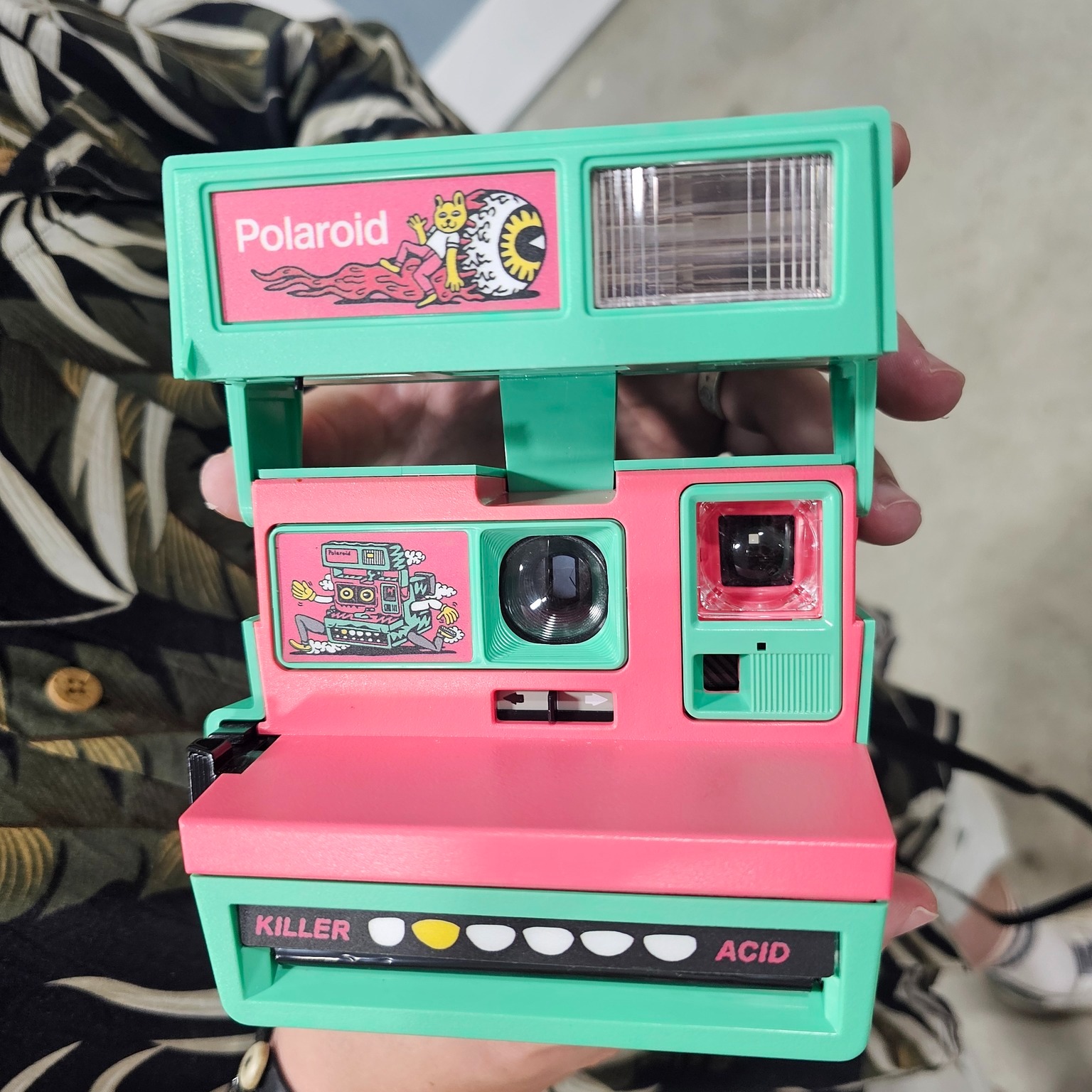 A boxy design with a flip-cover that reveals the lens, the 1986