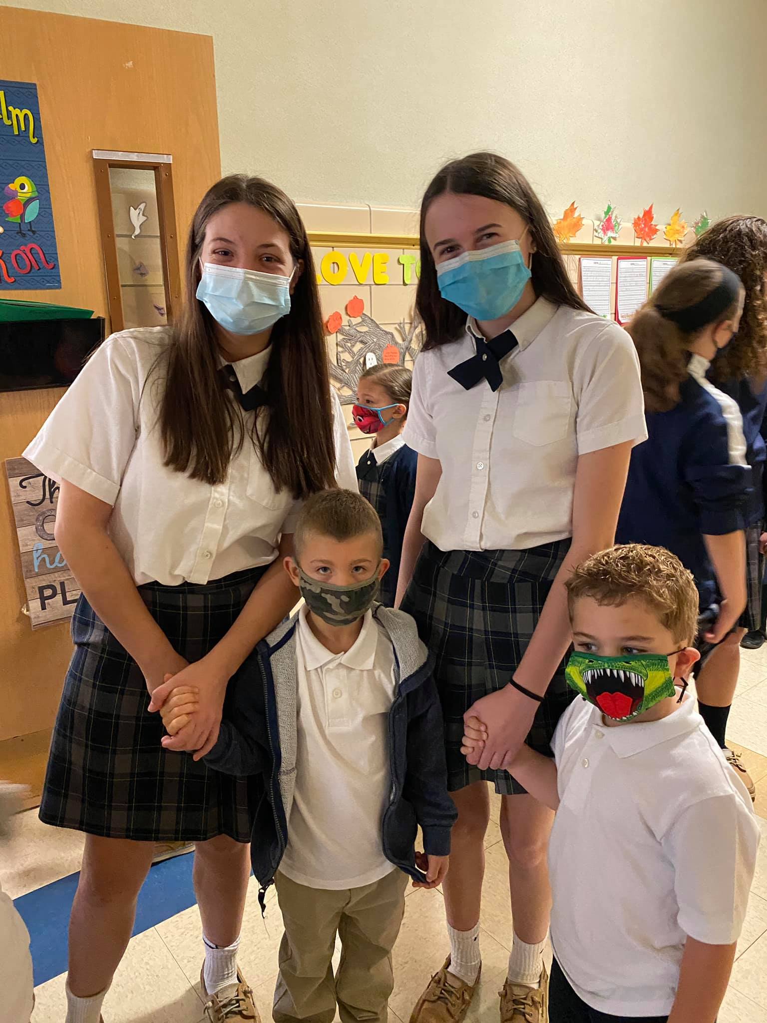 Our 8th graders and Kindergarten... - Holy Cross Academy