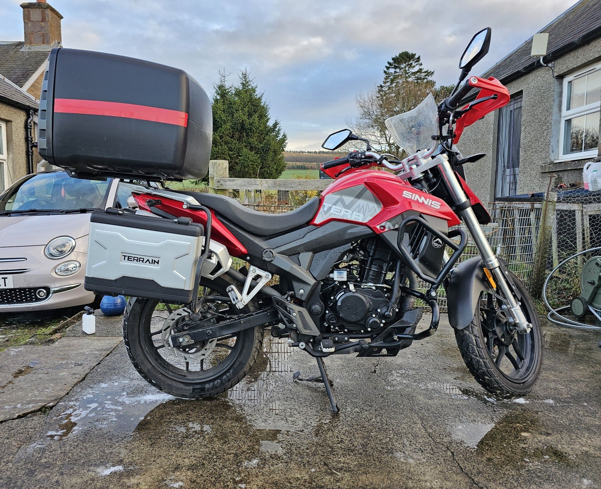Puig 100L Mega Box on the back of my old Sinnis. The TARDIS of top 