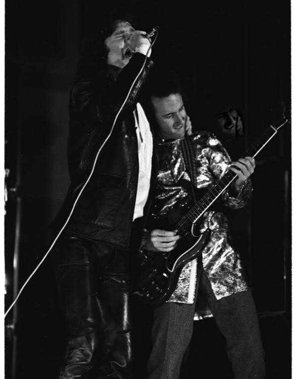 Jim Morrison grabbing Robby Krieger at a 1967 concert
