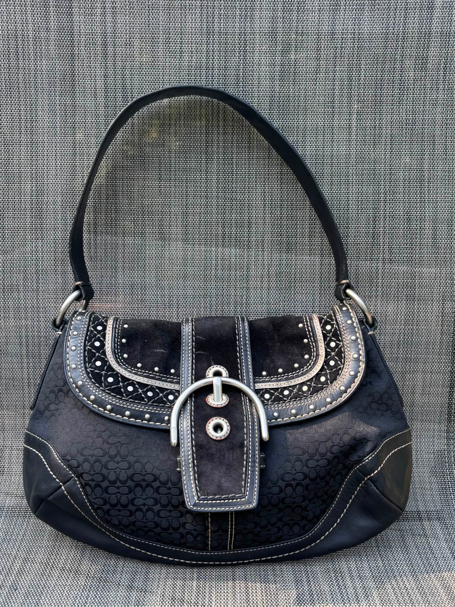 What is the value of a rare Y2K Coach Soho Signature Studs Black 