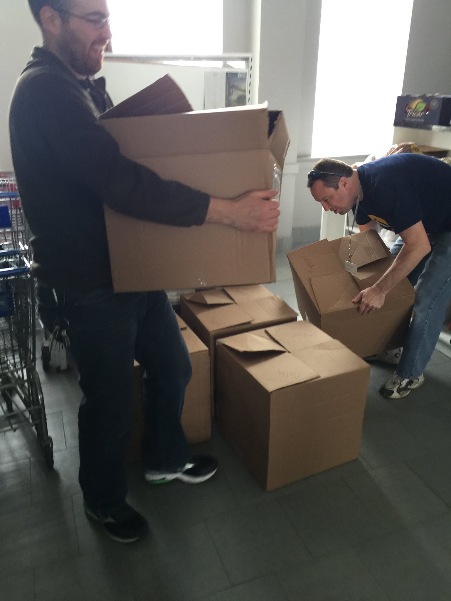 City - CDA staffers, Paul Werner and Bill Rataj, deliver canned goods ...