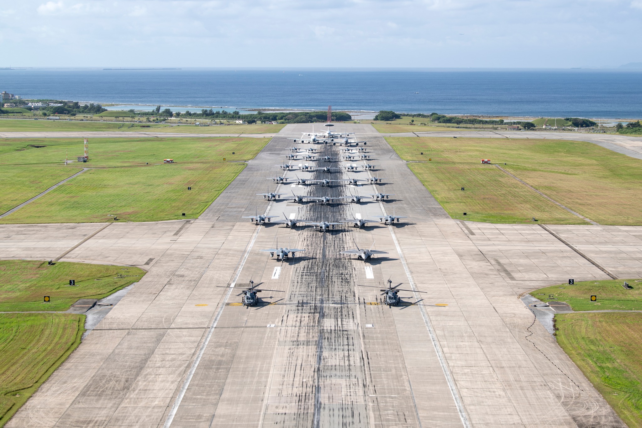 Ready to fly! ✈️ U.S. military aircraft line up on the runway