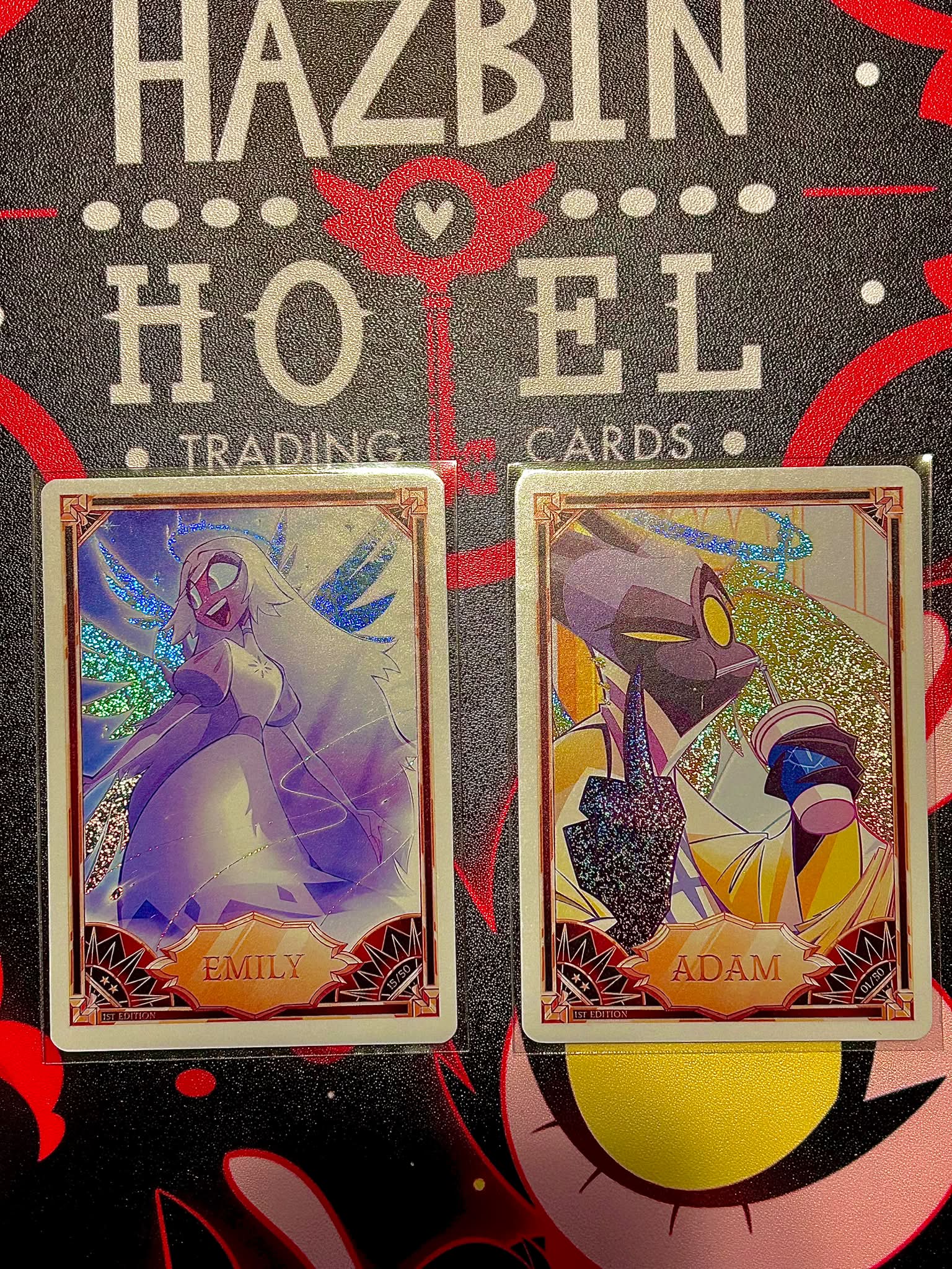 Foil Adam and Baxtor cards from Hazbin Hotel