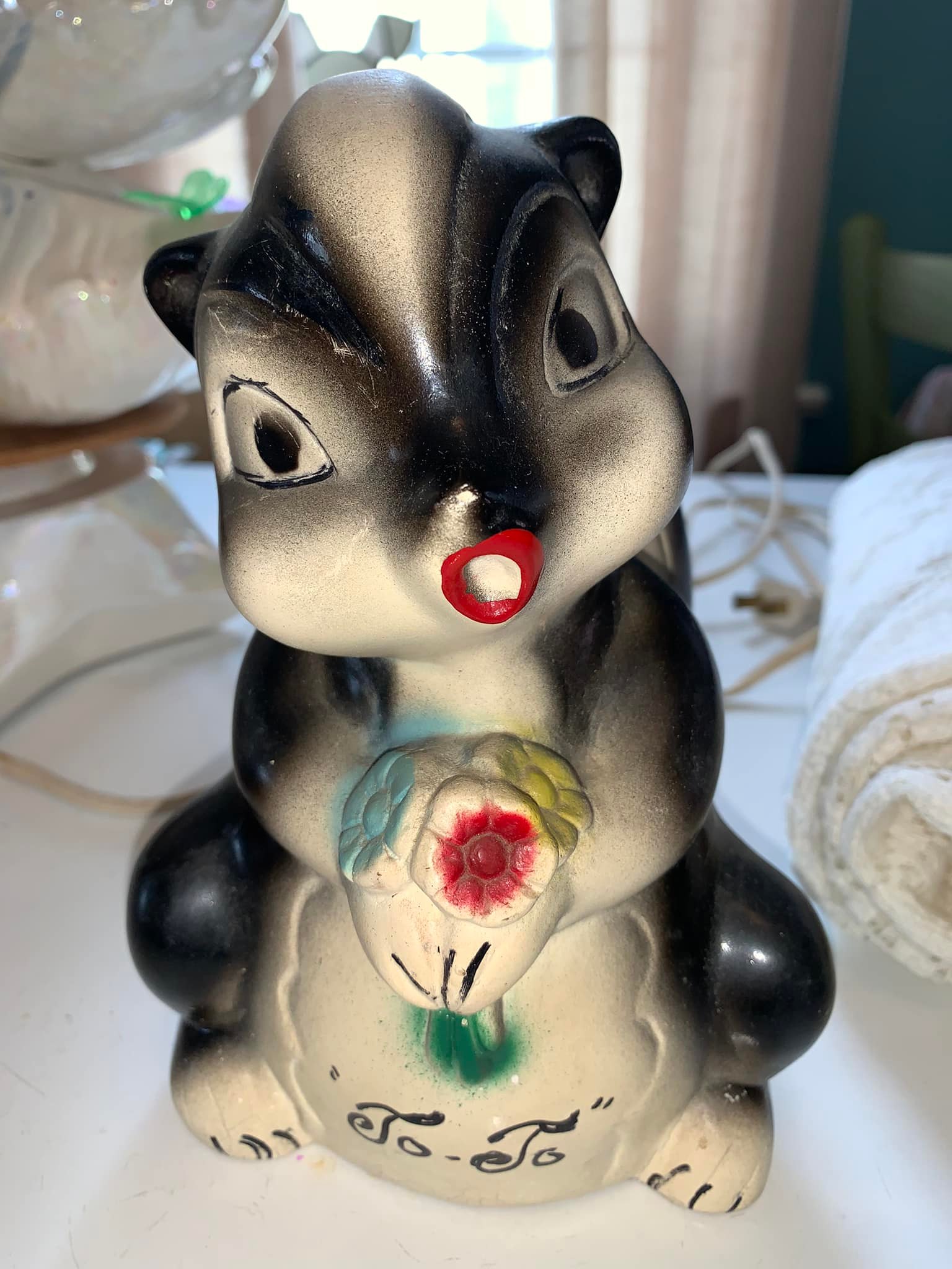 Adorable skunk figurine found at antique depot