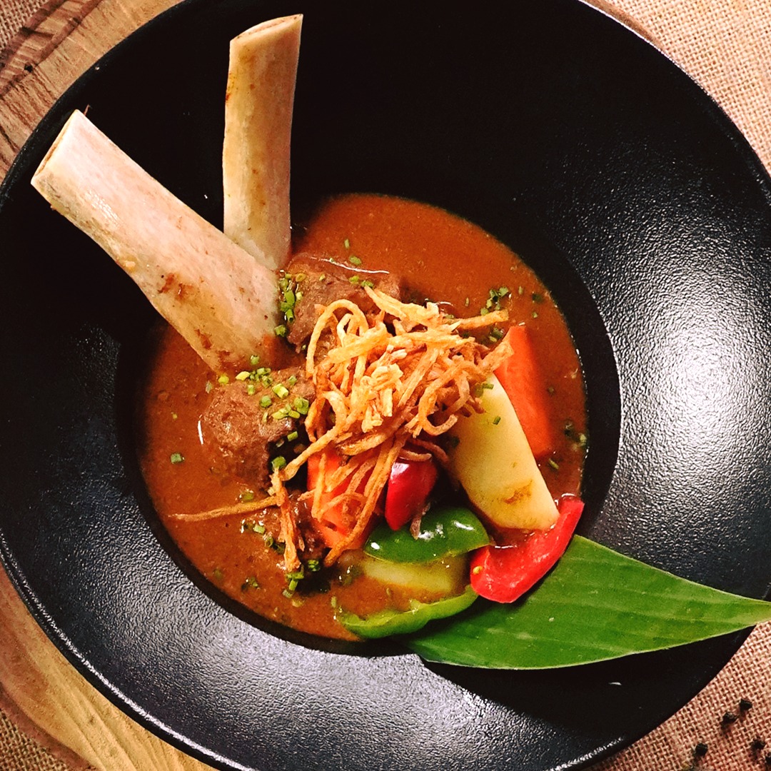 Benny's Place - A local stew that is simmered long and...