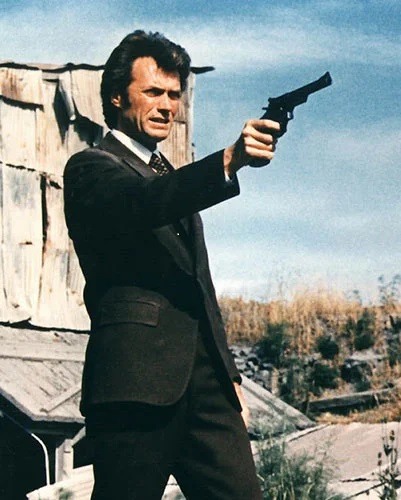 Clint Eastwood as Harry Callahan holding his 44 Magnum Gun in