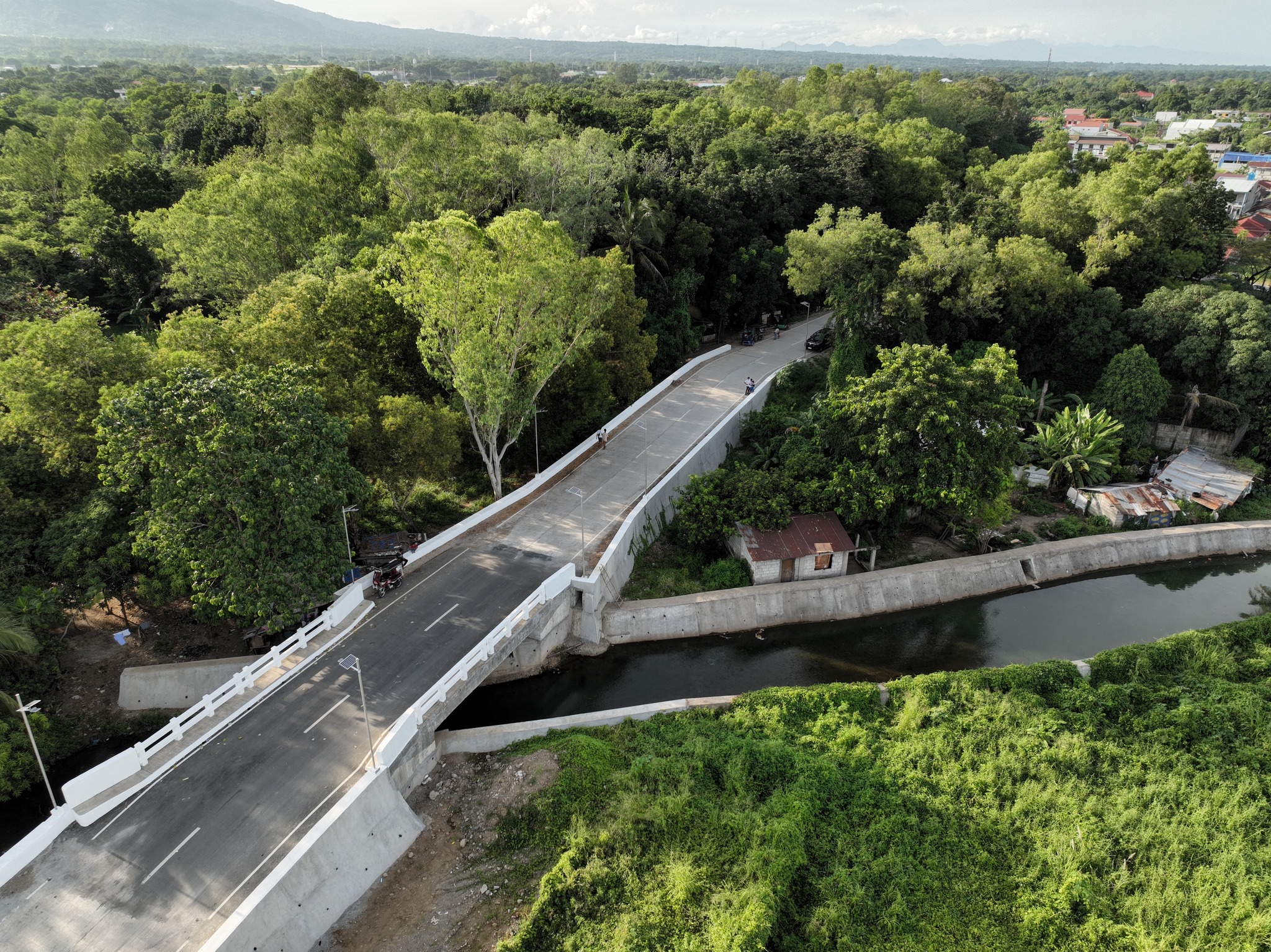 DPWH - DPWH COMPLETES BRIDGE, IMPROVES ROAD SECTION ALONG TENEJERO ...