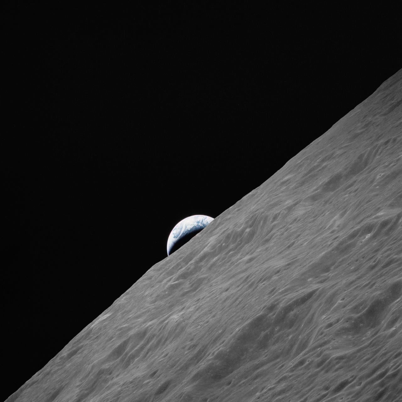 Astronomy - A Breathtaking View: Earth Rising Over the Moon This iconic ...