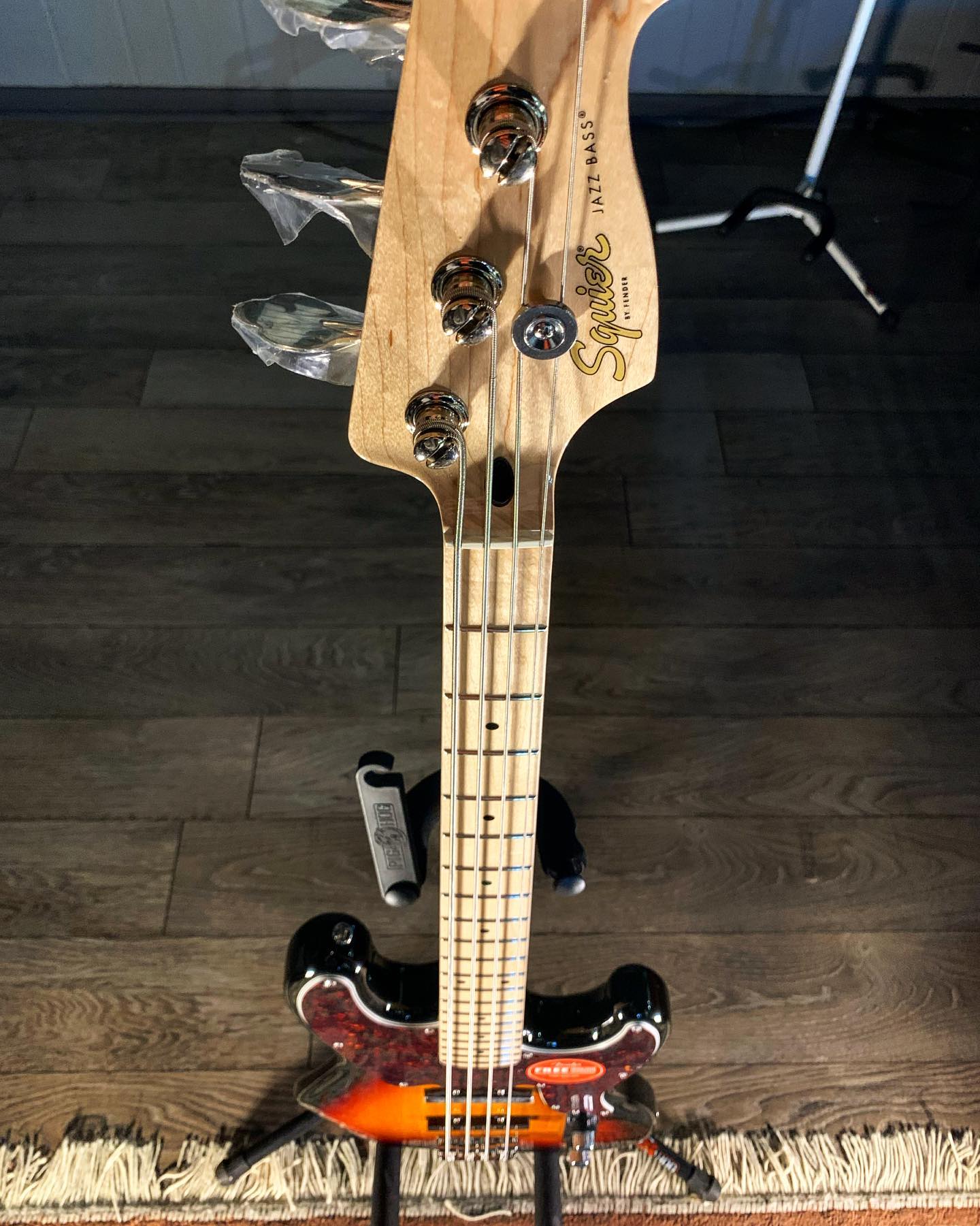 What is the difference between a Squier and Fender JB-355 Jazz Bass?