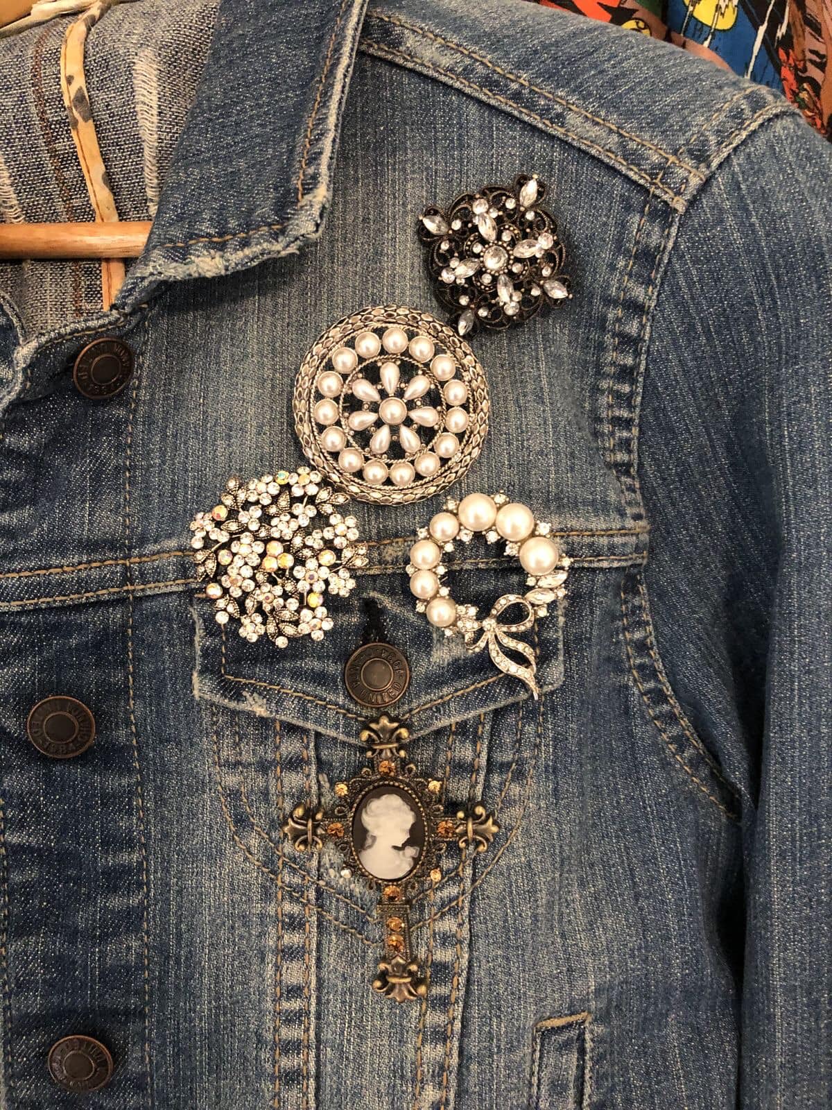 Spruce up your blue jean jacket with vintage brooches. You can 