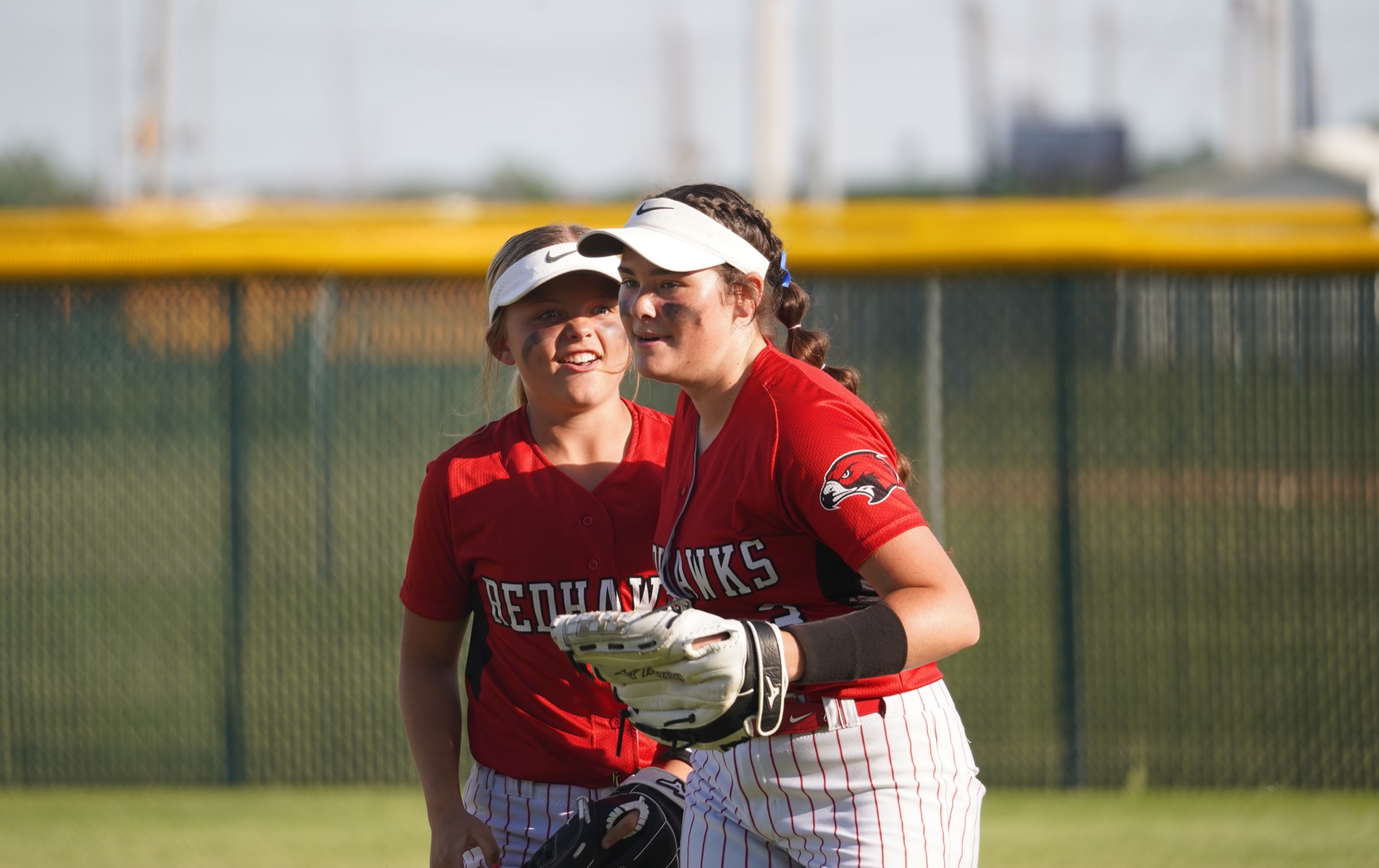 North - As they leave the field, outfielder Adi Fuller (left) reacts ...
