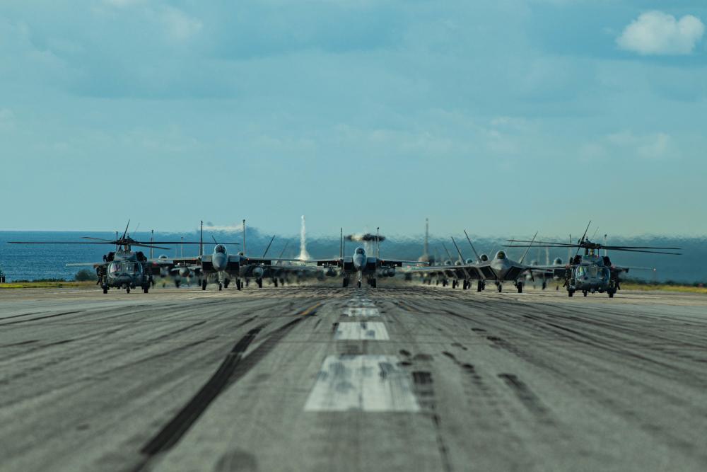 Ready to fly! ✈️ U.S. military aircraft line up on the runway