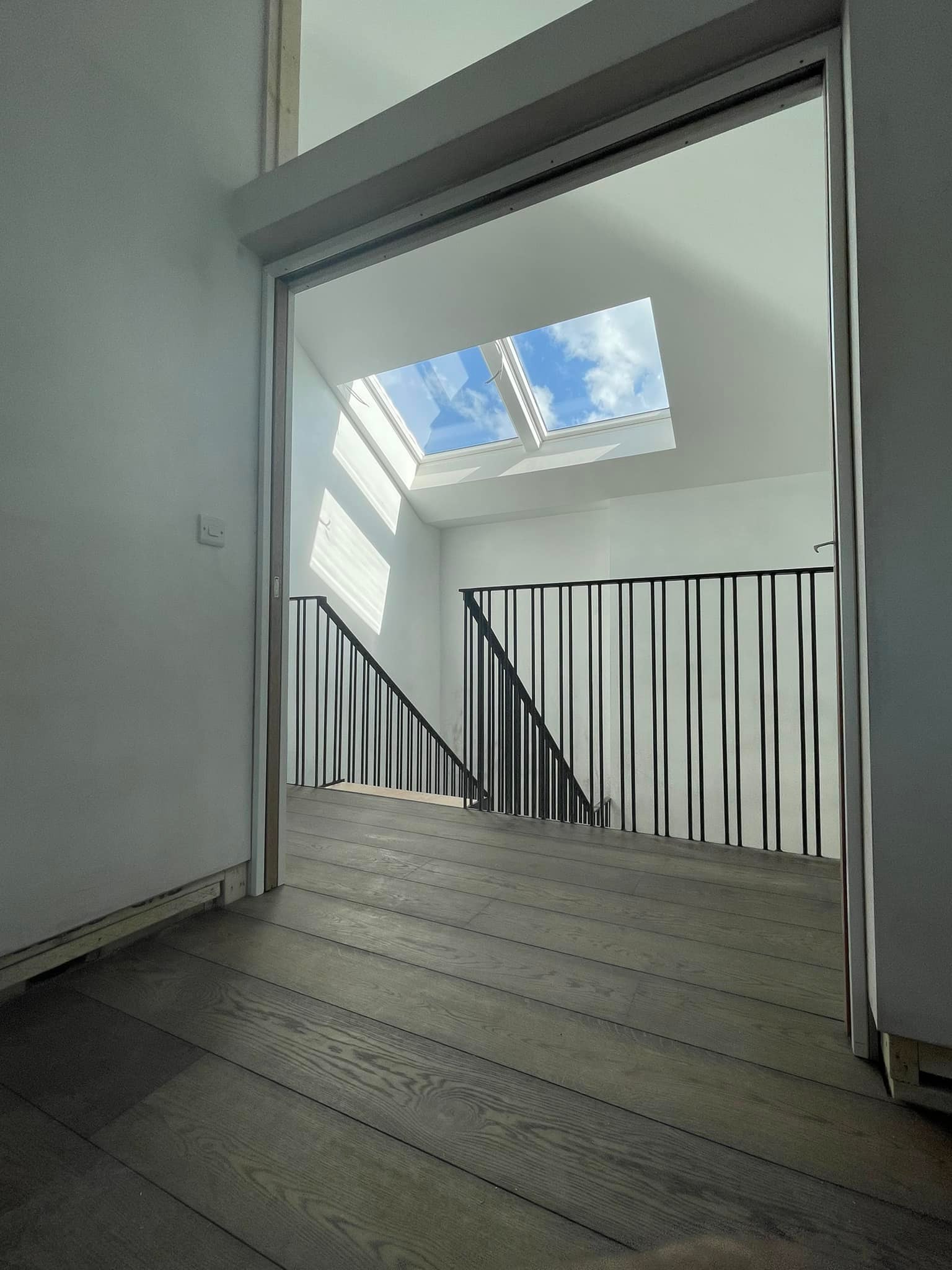 DP Building - Stairwell and top landing with vaulted...