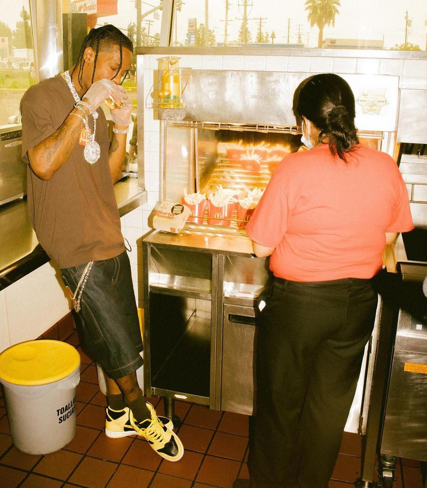 Travis Scott wearing the Nike Dunk High OG “Wu-Tang” from 1999 