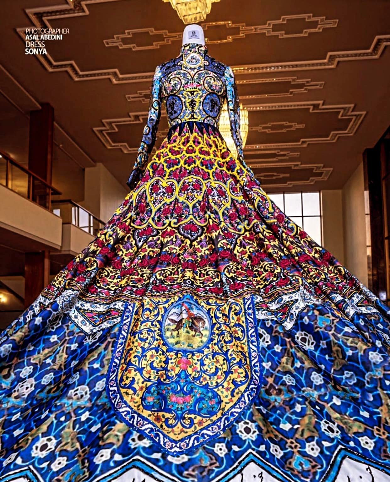 This dress is designed by an Iranian designer and inspired by Persian architecture and its renowned tile work and geometry. It's taken 200 people 3 years to finish it. Designer: Sonya