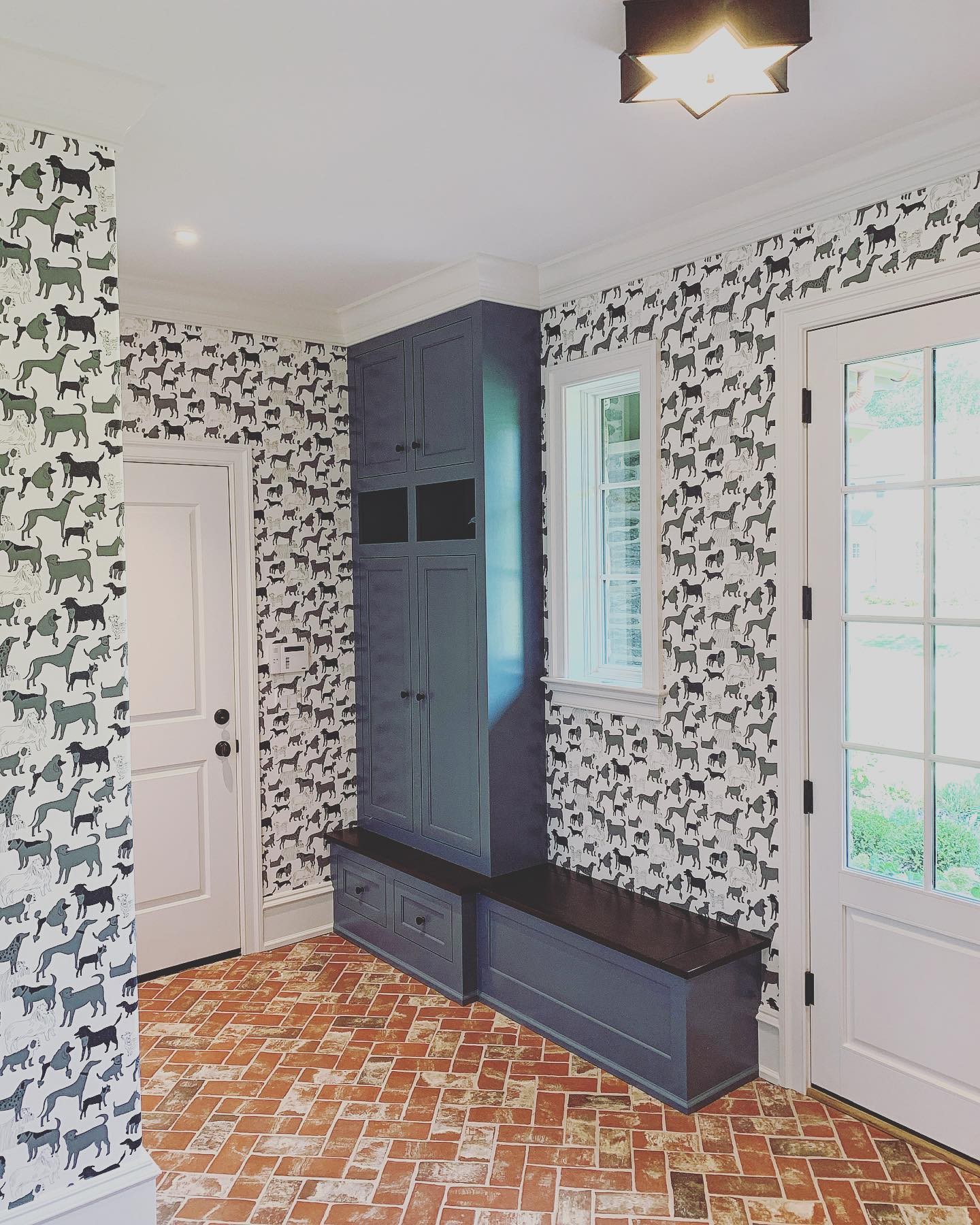 A welcoming back entry and a place... - Viola Interior Design