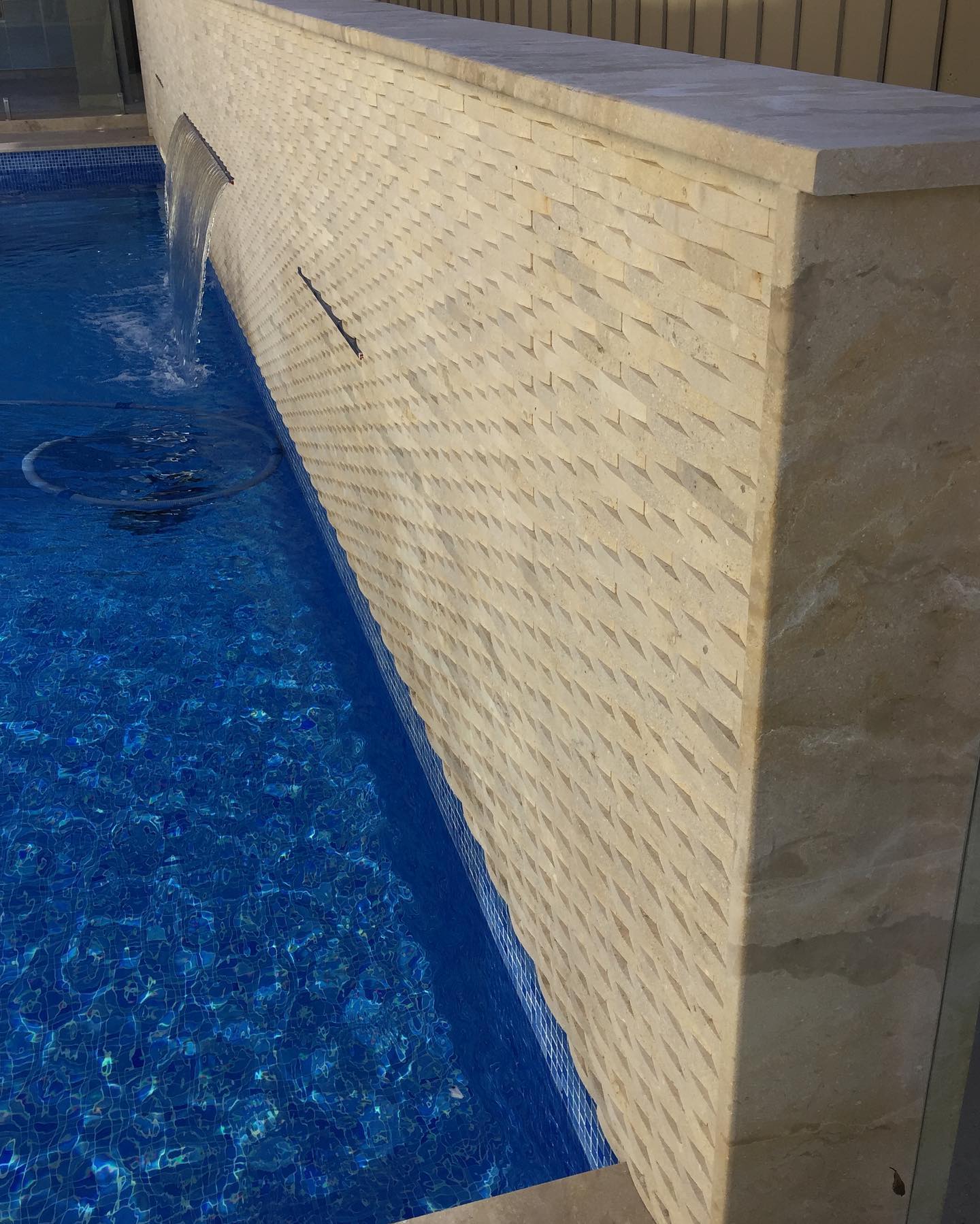 Marble Plus - Our Oyster wave cladding used for this pool feature wall ...